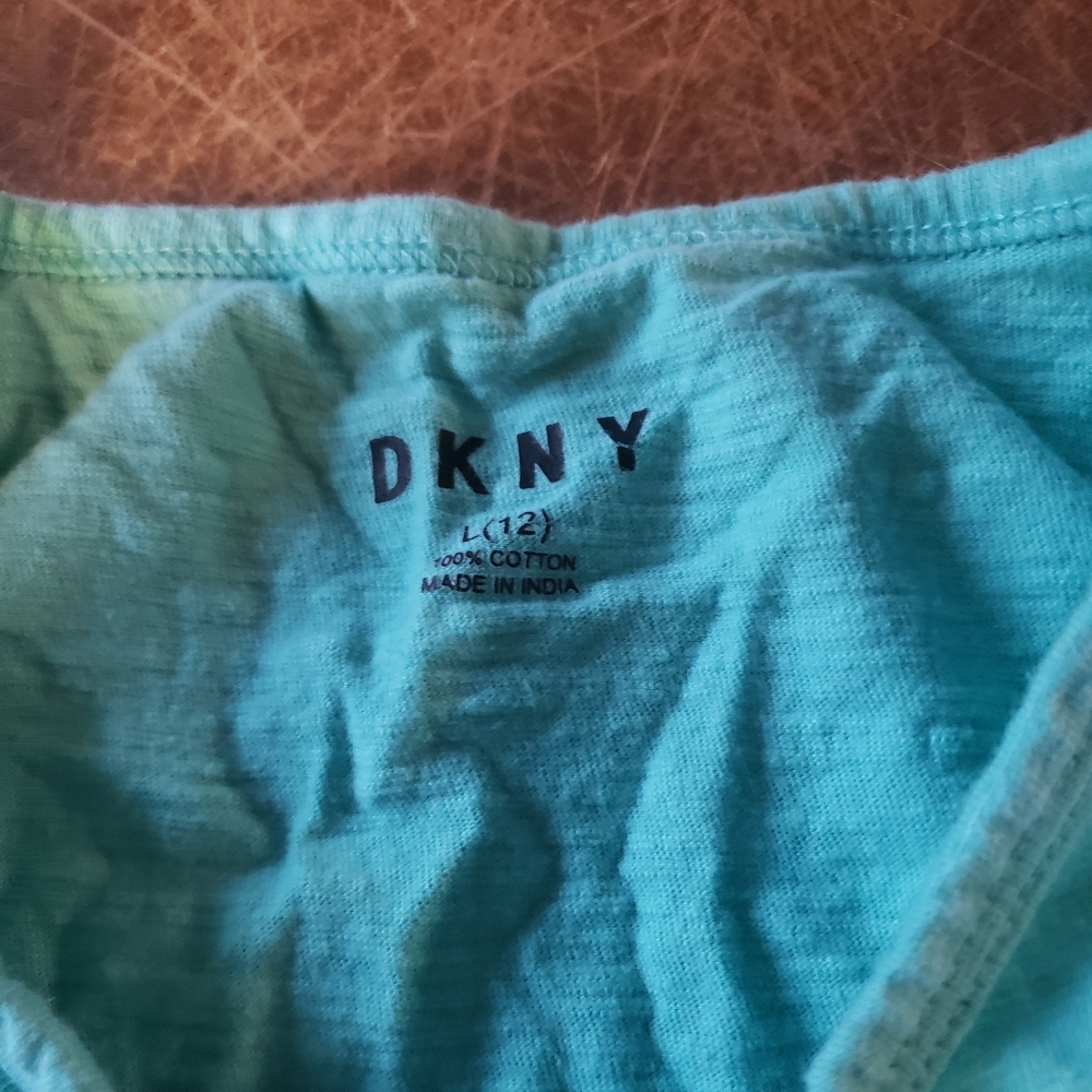 Tank top that has NY on it and says DKNY